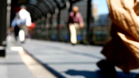 Anonymous-crowd-of-people-walking-on-walk-way-in-rush-hour