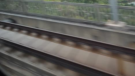 Moving-train-point-of-view-footage,-fast-motion-mode.