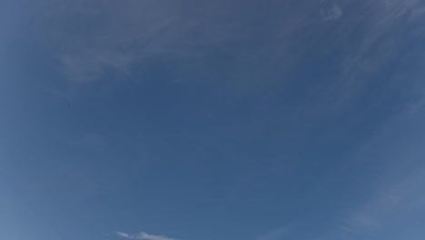 Time-lapse-clip-of-white-clouds-over-blue-sky