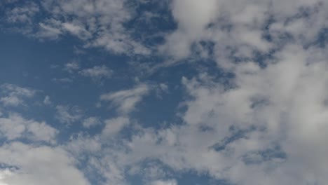 Time-lapse-clip-of-white-clouds-over-blue-sky