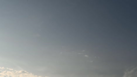 Time-lapse-clip-of-white-clouds-over-blue-sky