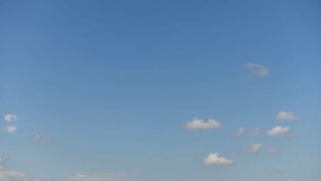 Time-lapse-clip-of-white-clouds-over-blue-sky