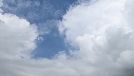 Time-lapse-clip-of-white-clouds-over-blue-sky