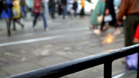 Crosswalk.-People-cross-the-street-at-a-pedestrian-crossing-in-a-big-city.-Cars-stopped-at-a-traffic-light.