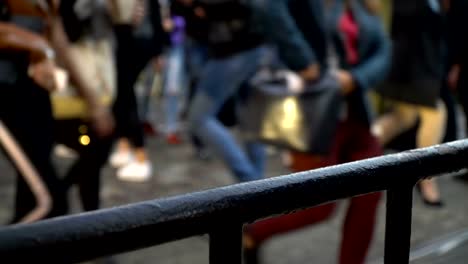 Crosswalk.-People-cross-the-street-at-a-pedestrian-crossing-in-a-big-city.-Cars-stopped-at-a-traffic-light.