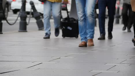 Feet-of-people-walking-on-the-city-street