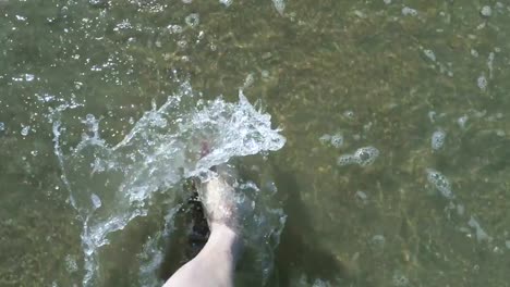 Walking-in-waves-on-sand-beach