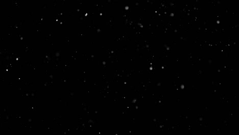 White-Snow-Falling-on-Isolated-Black-Background