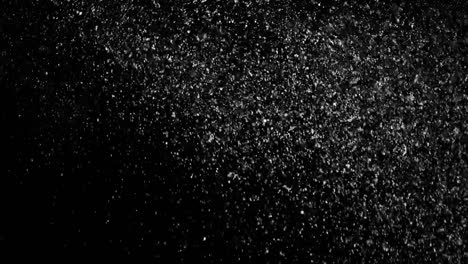 White-Snow-Falling-on-Isolated-Black-Background