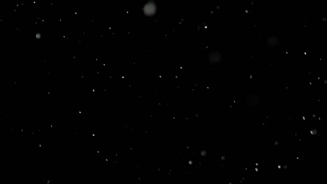 White-Snow-Falling-on-Isolated-Black-Background