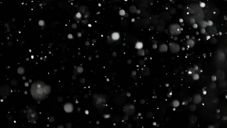 White-Snow-Falling-on-Isolated-Black-Background