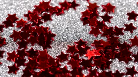 Sparkling-glitter-in-the-shape-of-a-star.-Close-up-on-a-silver-background