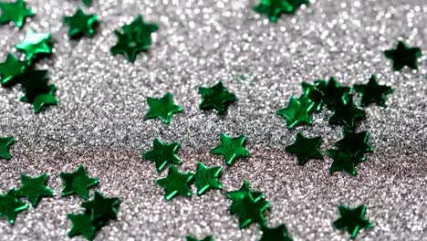 Sparkling-glitter-in-the-shape-of-a-star.-Close-up-on-a-silver-background