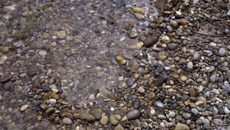 bank-wave-water-beach-stones-sand