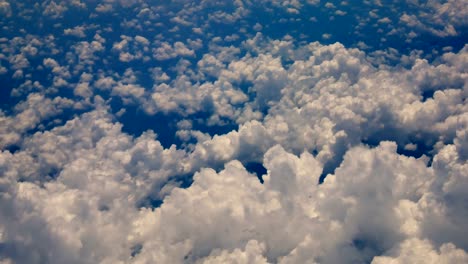 Travel-video-View-from-the-airplane-window-While-flying-through-the-cloud-and-bluesky-in-transportation-or-travel-concept.