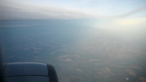 Blue-and-whithe-clouds-seen-through-the-window-of-jet-airplane-in-bright-sunny-day.-HD-video-High-Definition