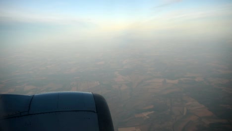 Lanscape-seen-through-the-window-of-jet-airplane-in-bright-sunny-day.-HD-video-High-Definition