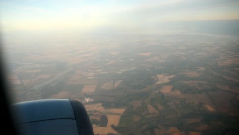 Lanscape-seen-through-the-window-of-jet-airplane-in-bright-sunny-day.-HD-video-High-Definition