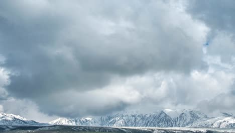 Fog-and-clouds-over-the-snowy-peaks-of-the-mountains-in-Kazakhstan.-Timelapse-FullHD