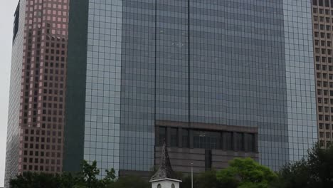 Old-Church-in-a-Clearing-with-Skyscrapers-in-the-Background