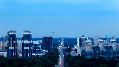 Traffic-time-lapse-of-Kyiv-city,-city-skyline-at-sunset.