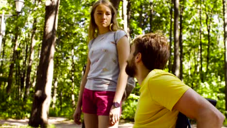 Young-disable-man-with-his-wife-on-a-walk-in-the-park