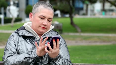 Woman-using-smartphone-at-the-outdoor