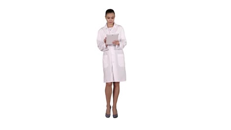 Doctor-using-tablet-while-walking-on-white-background