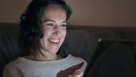 Woman-using-digital-tablet-at-home