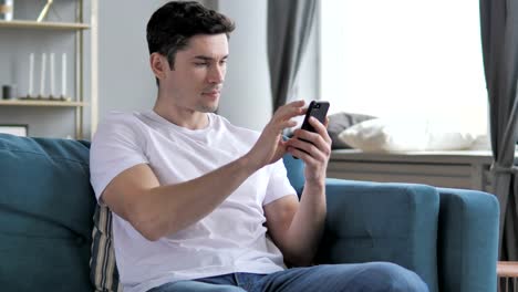 Gray-Hair-Businessman-Using-Smartphone