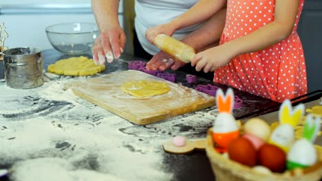 Little-Girl-and-Grandma-Rolling-Out-a-Dough