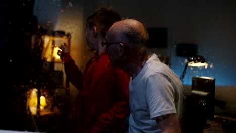 Boy-watching-storm-with-grandfather