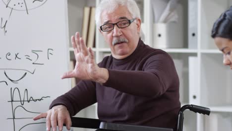 Male-Professor-Talking-to-Students-in-Class