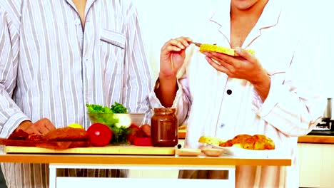 Happiness-gay-couple-preparing-food-at-the-kitchen-in-the-morning-and--have-a-breakfast.