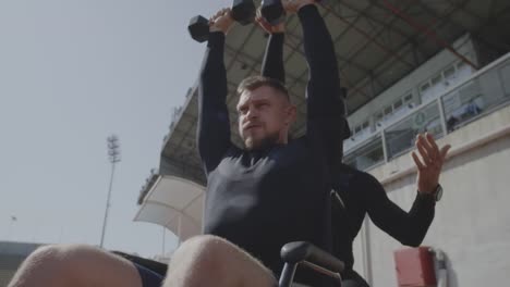 Wheelchaired-athlete-lifting-kettlebell