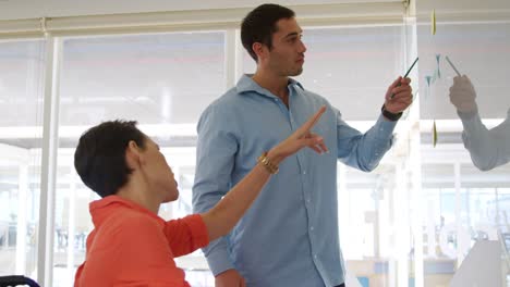 Young-man-and-woman-working-in-a-creative-office