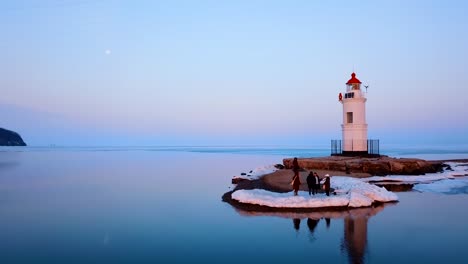 Aerial-winter-view-of-the-Tokarevskiy-lighthouse---one-of-the-oldest-lighthouses-in-the-Far-East,-still-an-important-navigational-structure-and-popular-attractions-of-Vladivostok-city,-Russia.