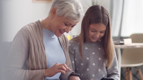 Kid-Helping-Old-Woman-Mastering-Modern-Devices