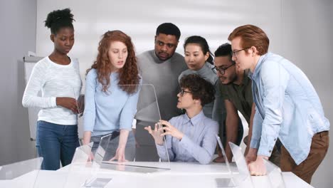 Female-Teacher-Demonstrating-New-Lesson-on-Touchscreen-AR-Tablet-Computer