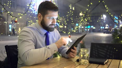 Businessman-browsing-tablet,-look-at-camera,-evening,-cafe,-portrait