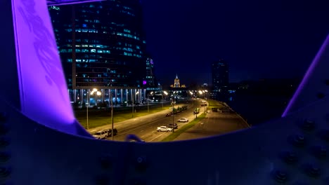 Moscow-river-near-the-skyscrapers-of-Moskva-City-district-in-the-night-timelapse-view-under-the-bridge