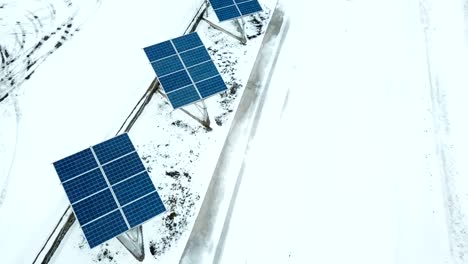 Aerial-solar-farm-low-flight-in-winter.