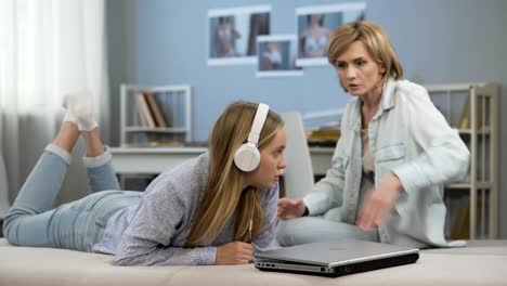 Mother-arguing-with-teen-daughter-for-spending-too-much-time-in-social-networks