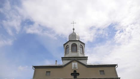 Eastern-orthodox-crosses-on-gold-domes-cupolas-against-blue-cloudy-sky