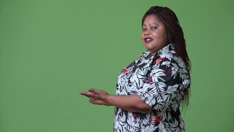 Overweight-beautiful-African-woman-against-green-background