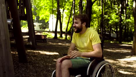 Young-disable-man-with-his-wife-on-a-walk-in-the-park