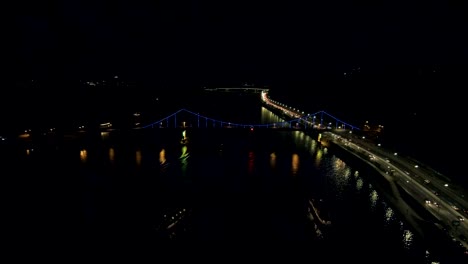 Aerial-view-from-Drone:-Top-view-of-the-night-promenade-with-bridges-and-cars.