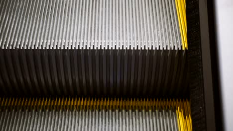 Escalator.-Steps-with-a-yellow-escalator