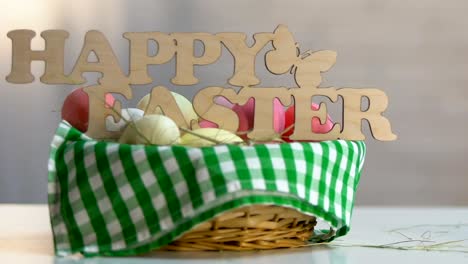 Cute-white-bunny-running-along-basket-with-colored-eggs-and-happy-Easter-sign