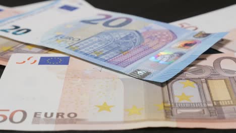 Euro-paper-money-counting-in-different-values-in-4K-3840X2160-UHD-footage---Lot-of-European-Union-banknotes-falling-on-table-4K-2160p-30fps-UltraHD-video